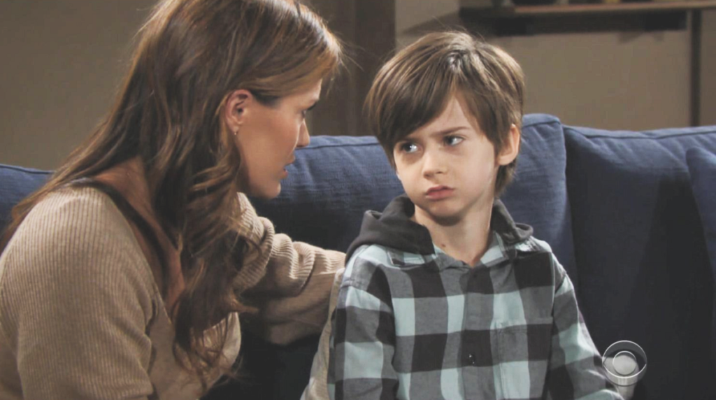 Connor Newman (son) looking unhappily at his mother Chelsea Lawson