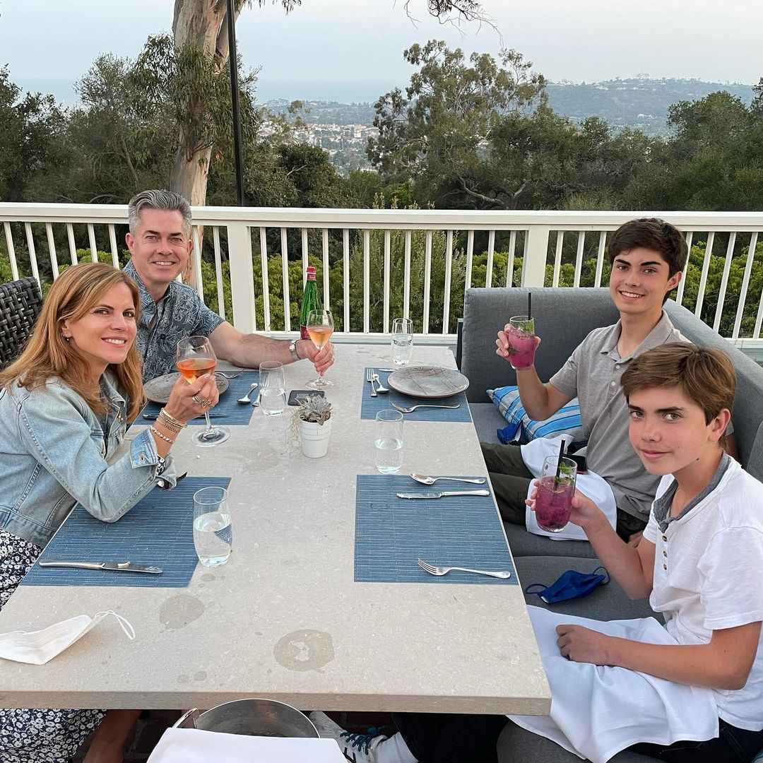 Natalie morales raising a toast with husband children