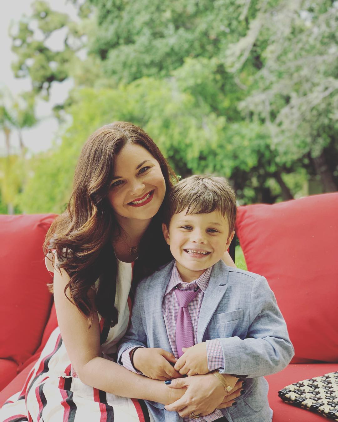 Heather Tom with his son Zane Alexander who's wearing suit.