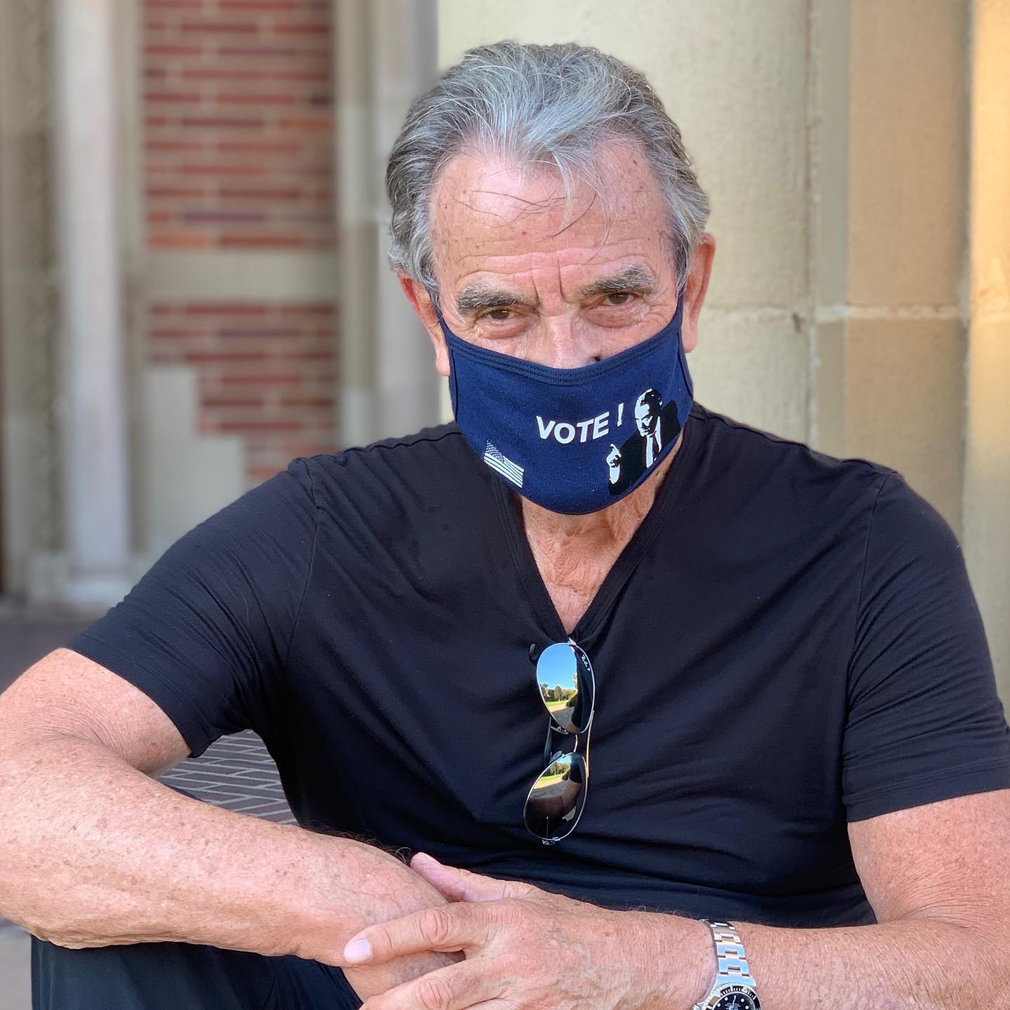 Eric Braeden wearing the mask with VOTE printed on it.