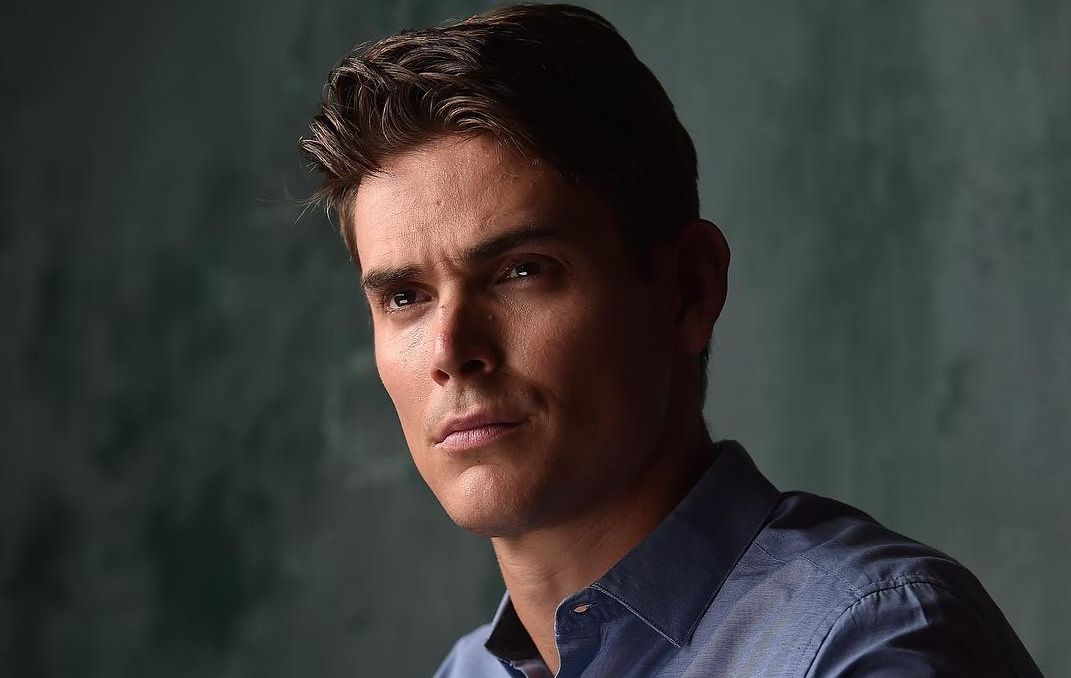 Mark Grossman looking away from the camera as he stares at something.