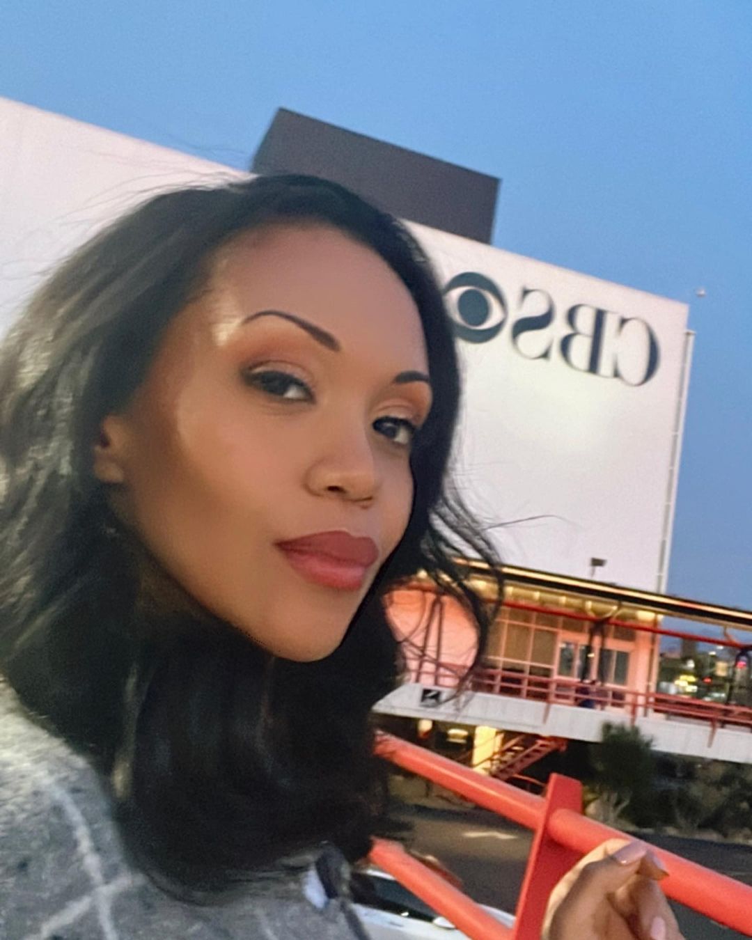Mishael Morgan in front of the CBS building. 