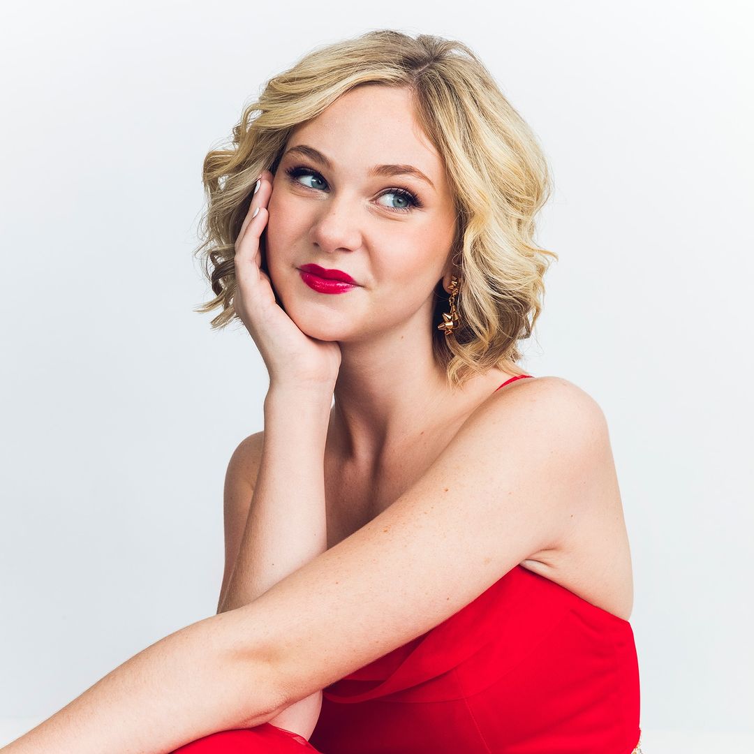 lily Brooks O'Briant waring red dress for her album cover